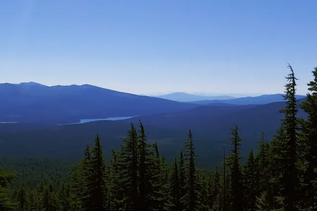 Sky Lakes Wilderness: a lake below forested ridges from the trail